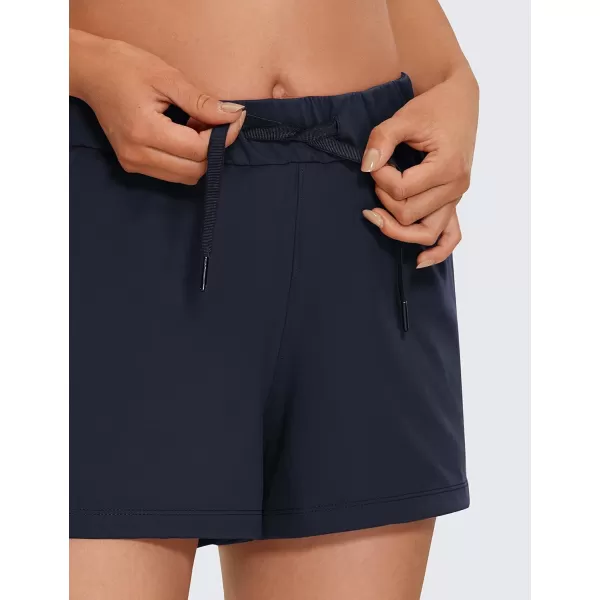 CRZ YOGA Stretch Shorts for Women Work Casual 25  Athletic Shorts with Pockets for Workout Travel Hiking GolfNavy