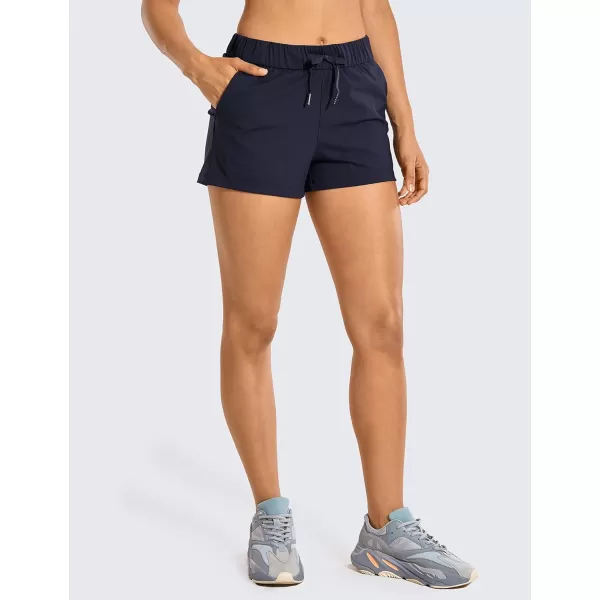 CRZ YOGA Stretch Shorts for Women Work Casual 25  Athletic Shorts with Pockets for Workout Travel Hiking GolfNavy