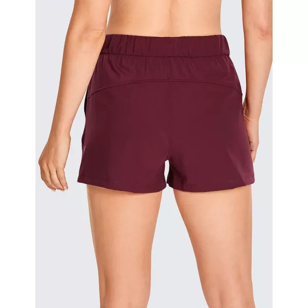 CRZ YOGA Stretch Shorts for Women Work Casual 25  Athletic Shorts with Pockets for Workout Travel Hiking GolfNoctilucence Red