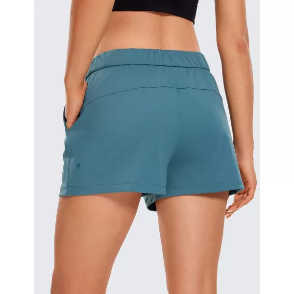 CRZ YOGA Stretch Shorts for Women Work Casual 25  Athletic Shorts with Pockets for Workout Travel Hiking GolfPetrol Blue