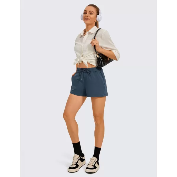 CRZ YOGA Stretch Shorts for Women Work Casual 25  Athletic Shorts with Pockets for Workout Travel Hiking GolfSlate Blue