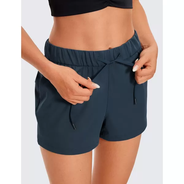 CRZ YOGA Stretch Shorts for Women Work Casual 25  Athletic Shorts with Pockets for Workout Travel Hiking GolfTrue Navy