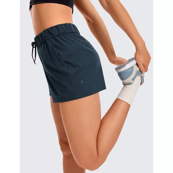 CRZ YOGA Stretch Shorts for Women Work Casual 25  Athletic Shorts with Pockets for Workout Travel Hiking GolfTrue Navy