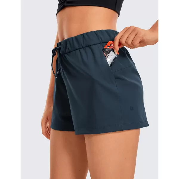 CRZ YOGA Stretch Shorts for Women Work Casual 25  Athletic Shorts with Pockets for Workout Travel Hiking GolfTrue Navy