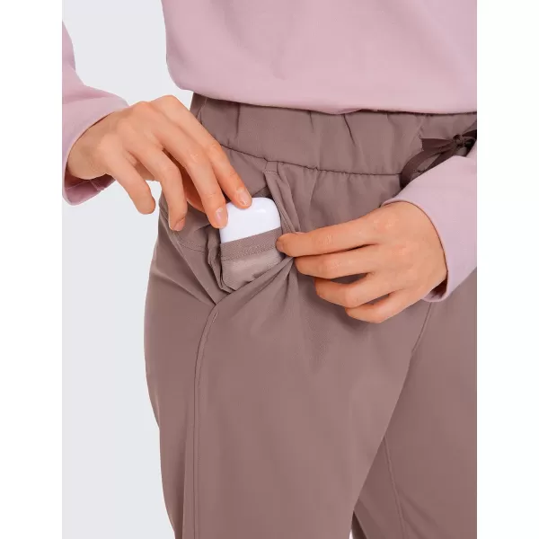 CRZ YOGA Womens 4Way Stretch Athletic Golf Pants  High Waisted Sweatpants Pockets Trave Lounge Workout Casual Work Trousers27 inches Geranyl
