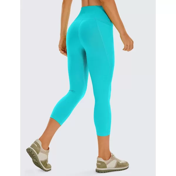 CRZ YOGA Womens Butterluxe Workout Capri Leggings with Pockets 21 Inches  High Waisted Gym Athletic Crop Yoga LeggingsNeon Spectral Blue