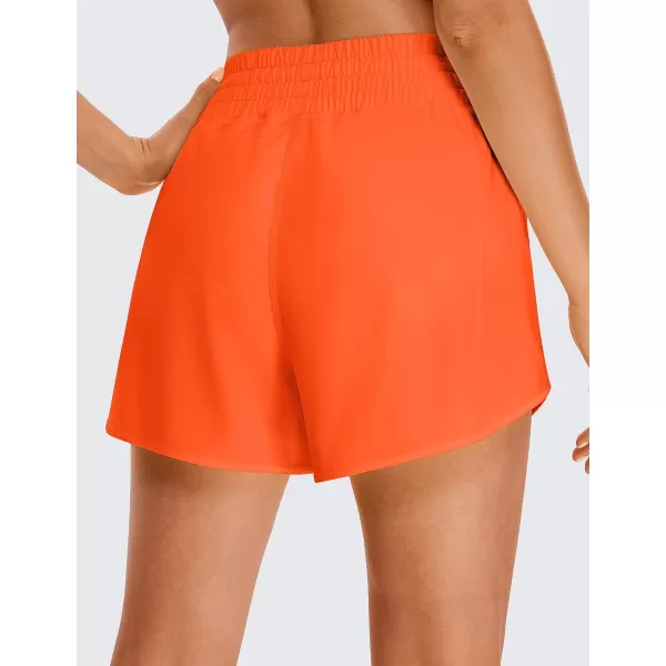 CRZ YOGA Womens High Waisted Running Shorts 4  Mesh Liner Lightweight Gym Sport Athletic Workout Shorts with Zipper PocketNeon Orange