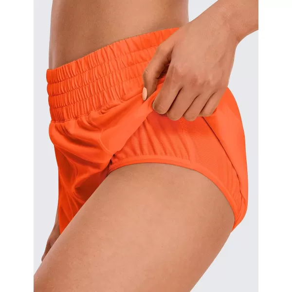 CRZ YOGA Womens High Waisted Running Shorts 4  Mesh Liner Lightweight Gym Sport Athletic Workout Shorts with Zipper PocketNeon Orange