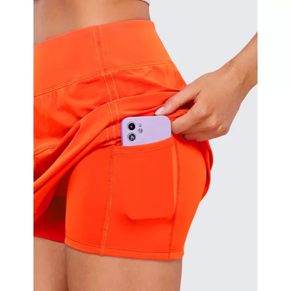 CRZ YOGA Womens High Waisted Tennis Skirts with 3 Pockets Golf Skirts A Line Lightweight Cute Athletic Casual SkortsNeon Orange