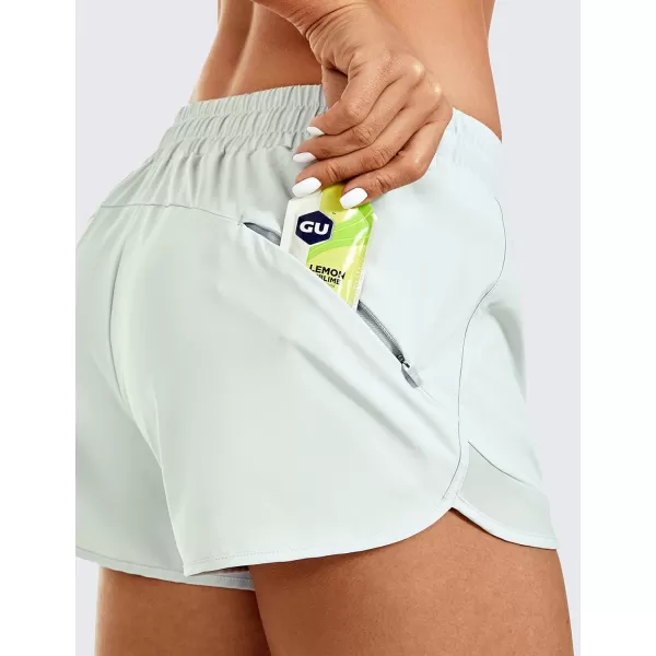 CRZ YOGA Womens Mid Rise Running Shorts Mesh Liner 3  Quick Dry Drawstring Workout Athletic Gym Shorts Zip PocketCoconut Milk White