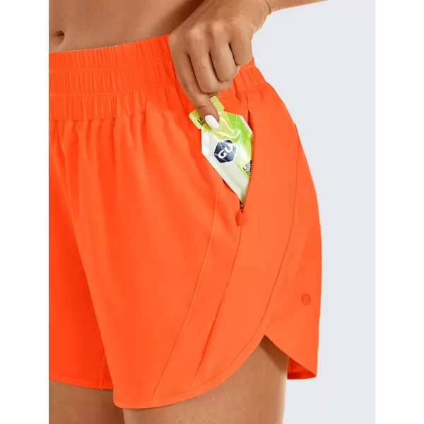 CRZ YOGA Womens Mid Waisted Running Shorts Liner  5 Quick Dry Athletic Sport Workout Track Shorts Zip PocketNeon Orange