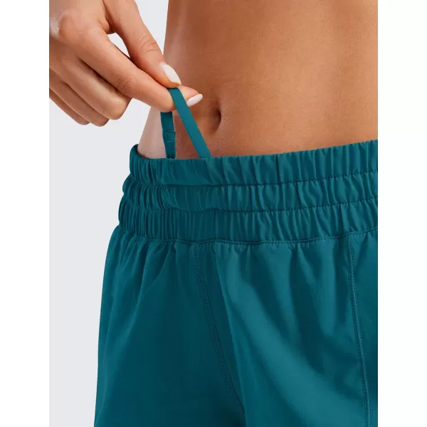 CRZ YOGA Womens Running Shorts Low Waisted 25  Mesh Liner Quick Dry Track Gym Athletic Workout Shorts with Zip PocketBorealis Green