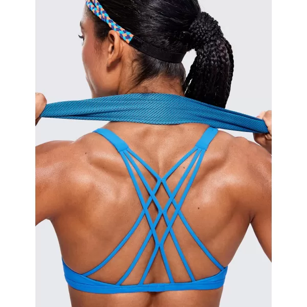 CRZ YOGA Womens Strappy Sports Bra  Criss Cross Back Padded Medium Support Wireless Gym Bra Sexy Workout Yoga BraMadagascar Blue