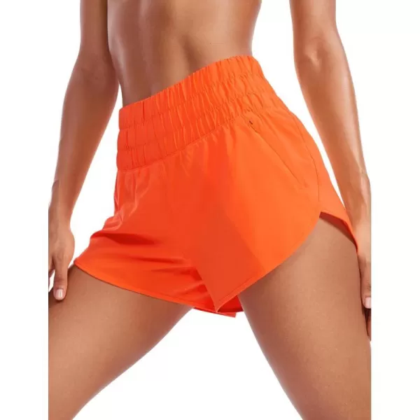 CRZ YOGA High Waisted Dolphin Running Shorts for Womens Mesh Liner Gym Workout Athletic Shorts with Zipper PocketNeon Orange