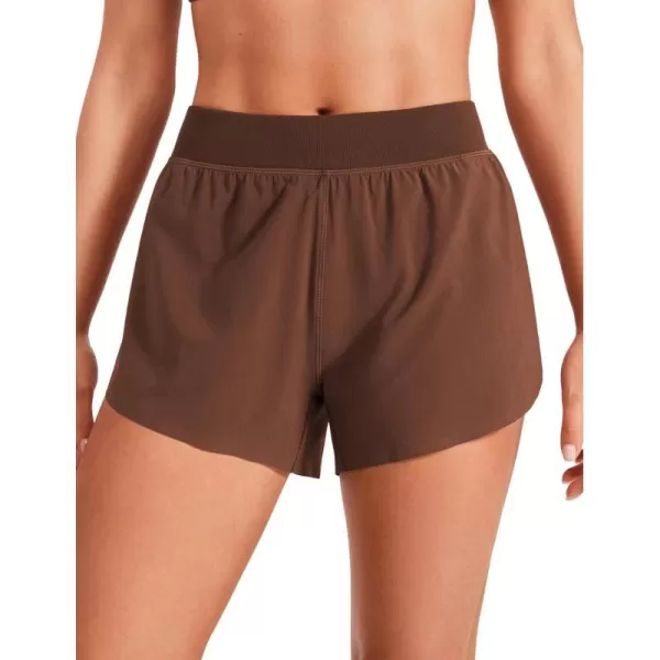 CRZ YOGA Mid Waisted Dolphin Athletic Shorts for Women Lightweight High Split Gym Workout Shorts with Liner Quick DryCoffee Brown