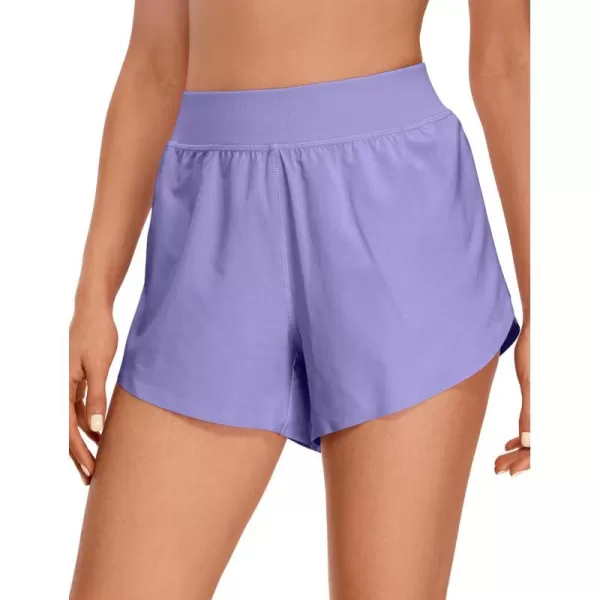 CRZ YOGA Mid Waisted Dolphin Athletic Shorts for Women Lightweight High Split Gym Workout Shorts with Liner Quick DryDark Lavender Purple