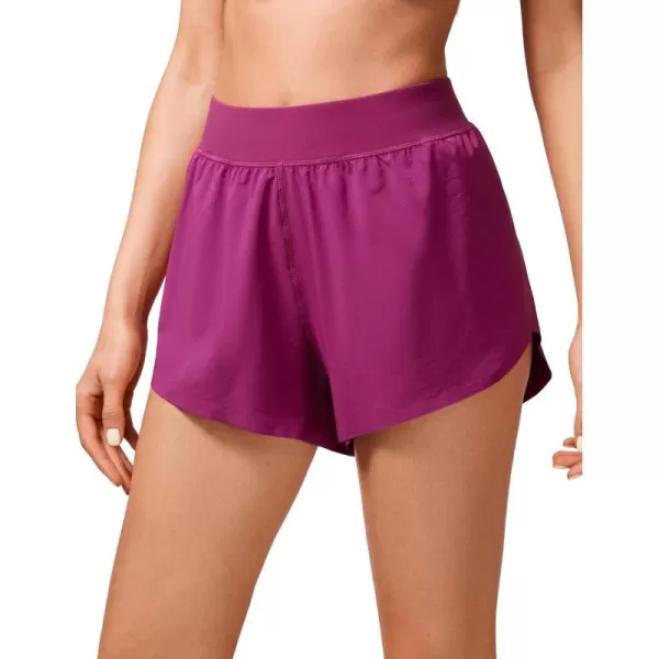 CRZ YOGA Mid Waisted Dolphin Athletic Shorts for Women Lightweight High Split Gym Workout Shorts with Liner Quick DryMagenta Purple