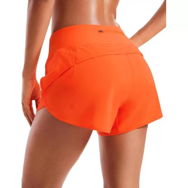 CRZ YOGA Mid Waisted Running Shorts for Women Soft Gym Athletic Workout Shorts with Zipper Pocket Liner Quick DryNeon Orange