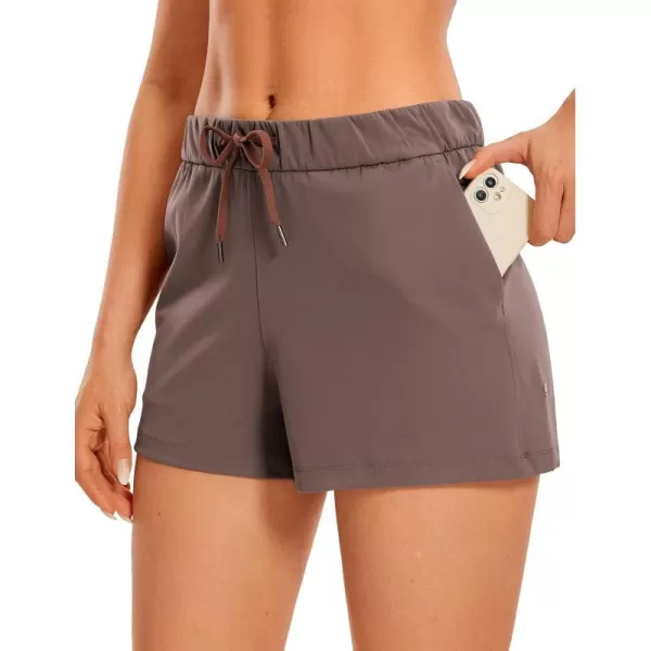 CRZ YOGA Stretch Shorts for Women Work Casual 25  Athletic Shorts with Pockets for Workout Travel Hiking GolfBrown Rock