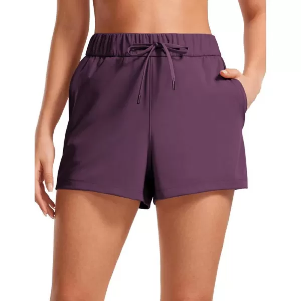 CRZ YOGA Stretch Shorts for Women Work Casual 25  Athletic Shorts with Pockets for Workout Travel Hiking GolfDeep Purple