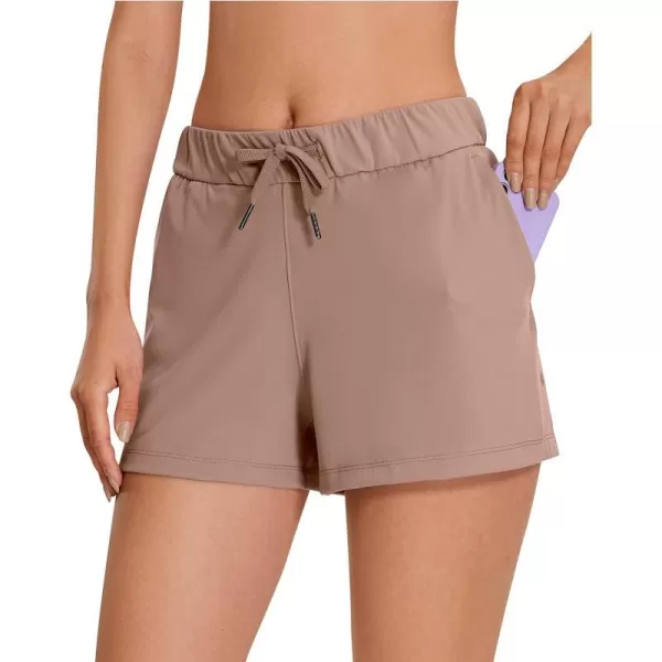 CRZ YOGA Stretch Shorts for Women Work Casual 25  Athletic Shorts with Pockets for Workout Travel Hiking GolfMineral Brown