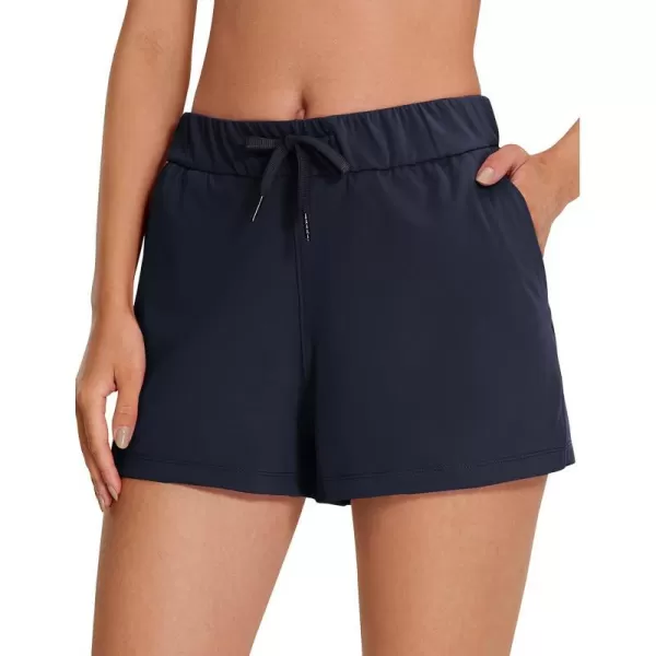CRZ YOGA Stretch Shorts for Women Work Casual 25  Athletic Shorts with Pockets for Workout Travel Hiking GolfNavy
