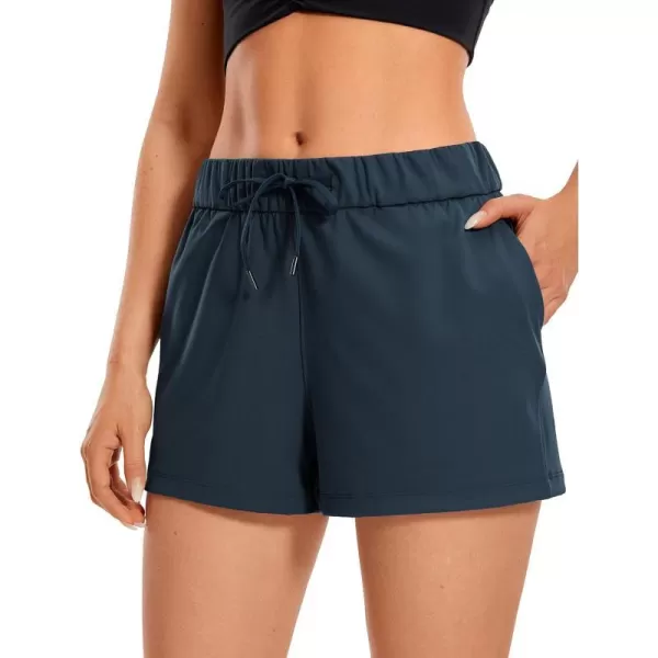 CRZ YOGA Stretch Shorts for Women Work Casual 25  Athletic Shorts with Pockets for Workout Travel Hiking GolfTrue Navy