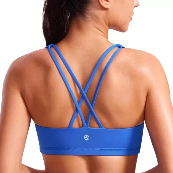 CRZ YOGA Womens Low Impact Strappy Sports Bra  Low Cut Wirefree Padded Yoga Bra Criss Cross BackSparkle Blue