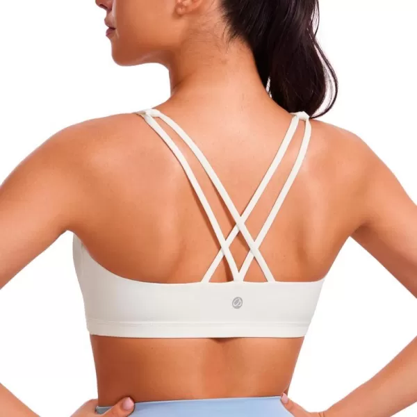 CRZ YOGA Womens Low Impact Strappy Sports Bra  Low Cut Wirefree Padded Yoga Bra Criss Cross BackWhite Apricot