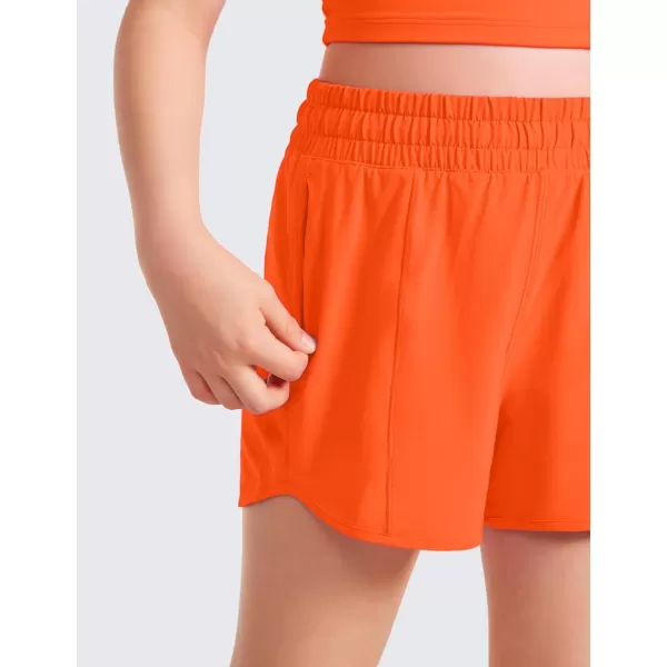 CRZ YOGA Girls Athletic Shorts with Zipper Pocket Lightweight Running Shorts for Teen Girls Kids LinerNeon Orange