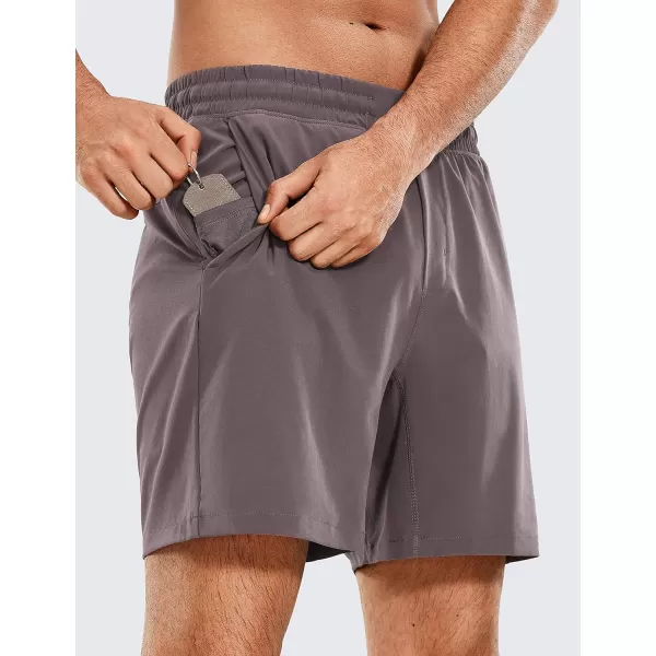 CRZ YOGA Mens 2 in 1 Running Shorts with Liner  5 7 9 Quick Dry Workout Sports Athletic Shorts with Pockets7 inches Purple Taupe