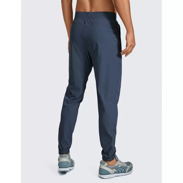 CRZ YOGA Mens Lightweight Joggers Pants  29 Quick Dry Workout Pants Track Running Gym Athletic Pants with Zipper PocketsElectric Blue