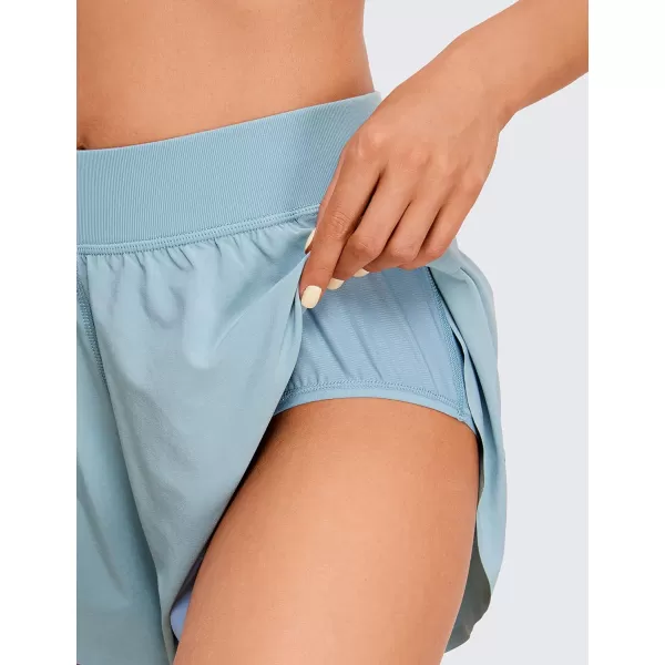 CRZ YOGA Mid Waisted Dolphin Athletic Shorts for Women Lightweight High Split Gym Workout Shorts with Liner Quick DryLight Grayish Blue