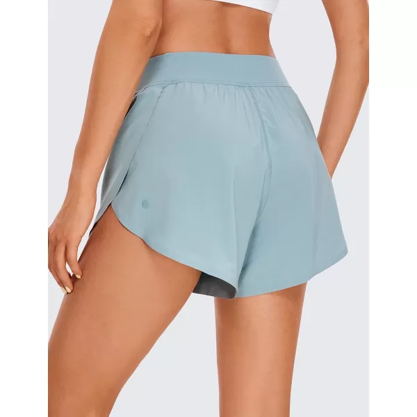 CRZ YOGA Mid Waisted Dolphin Athletic Shorts for Women Lightweight High Split Gym Workout Shorts with Liner Quick DryLight Grayish Blue