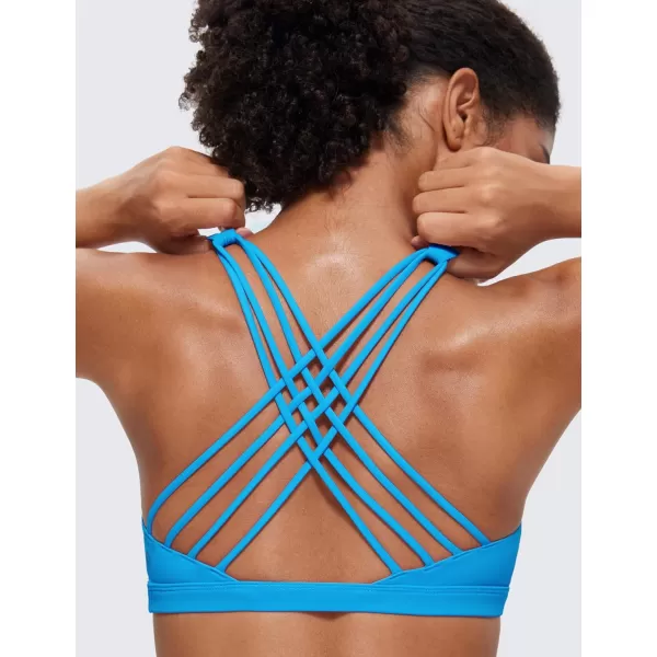 CRZ YOGA Strappy Sports Bras for Women  Criss Cross Back Sexy Wireless Padded Yoga Bra Cute WorkoutMadagascar Blue