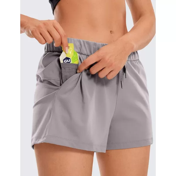 CRZ YOGA Stretch Shorts for Women Casual Work  Athletic Shorts with Pockets Travel Workout Hiking Golf Running Shorts25 inches Dark Chrome