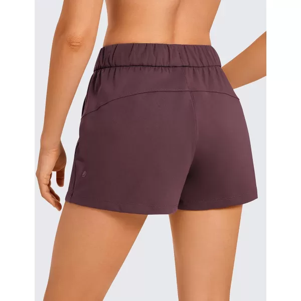 CRZ YOGA Stretch Shorts for Women Casual Work  Athletic Shorts with Pockets Travel Workout Hiking Golf Running Shorts25 inches Dark Russet