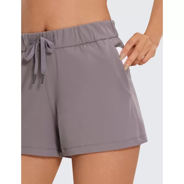 CRZ YOGA Stretch Shorts for Women Casual Work  Athletic Shorts with Pockets Travel Workout Hiking Golf Running Shorts25 inches Lunar Rock