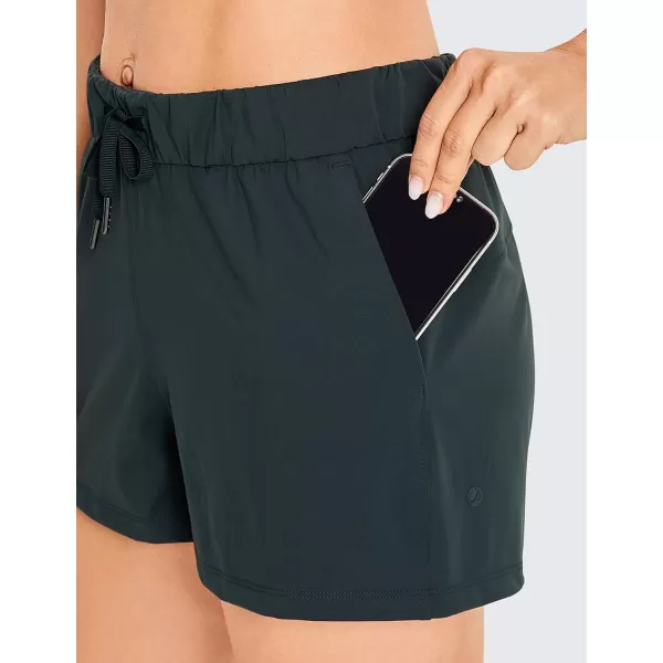 CRZ YOGA Stretch Shorts for Women Casual Work  Athletic Shorts with Pockets Travel Workout Hiking Golf Running Shorts25 inches Melanite