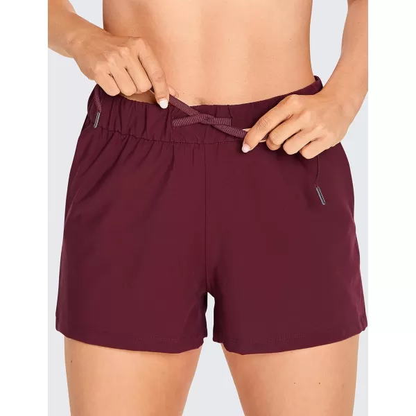 CRZ YOGA Stretch Shorts for Women Casual Work  Athletic Shorts with Pockets Travel Workout Hiking Golf Running Shorts25 inches Noctilucence Red