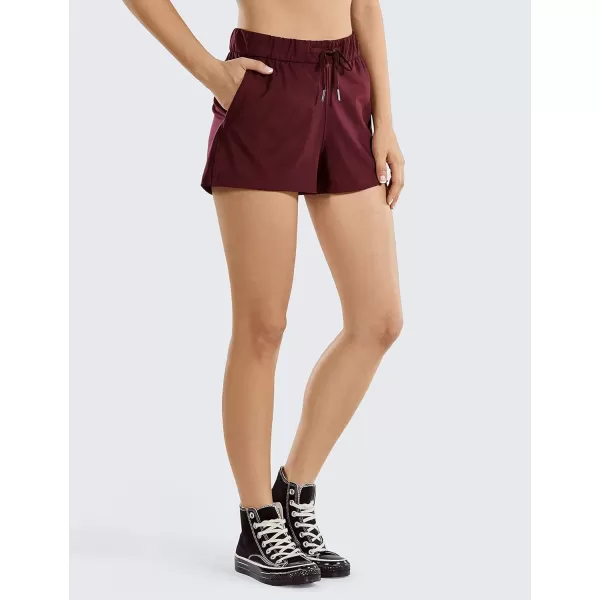 CRZ YOGA Stretch Shorts for Women Casual Work  Athletic Shorts with Pockets Travel Workout Hiking Golf Running Shorts25 inches Noctilucence Red