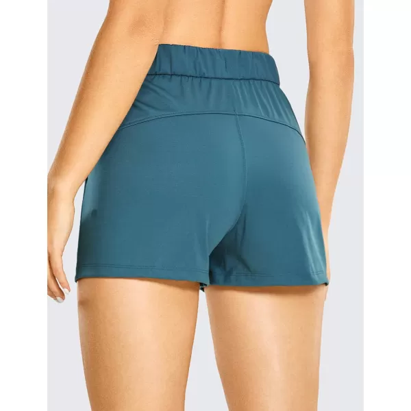 CRZ YOGA Stretch Shorts for Women Casual Work  Athletic Shorts with Pockets Travel Workout Hiking Golf Running Shorts25 inches Petrol Blue