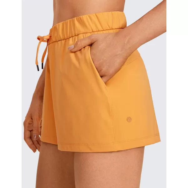 CRZ YOGA Stretch Shorts for Women Casual Work  Athletic Shorts with Pockets Travel Workout Hiking Golf Running Shorts25 inches Primulin