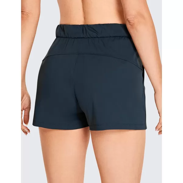 CRZ YOGA Stretch Shorts for Women Casual Work  Athletic Shorts with Pockets Travel Workout Hiking Golf Running Shorts25 inches True Navy