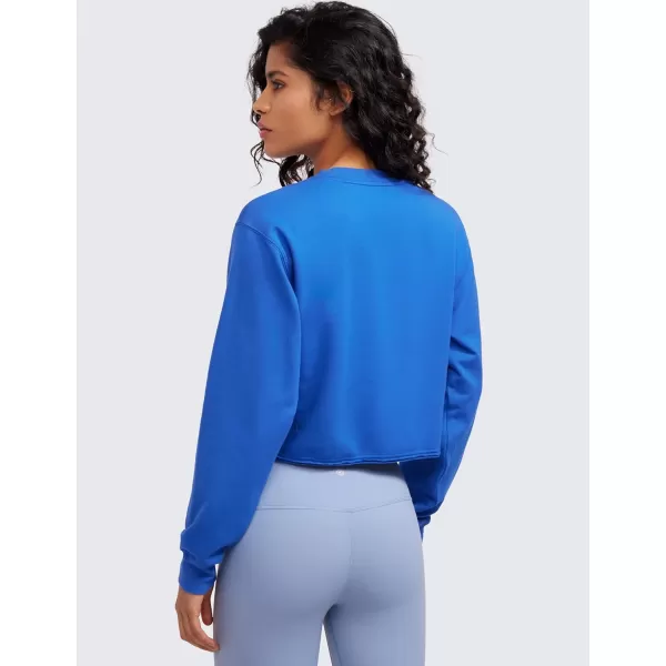 CRZ YOGA Womens Fleece Cropped Sweatshirts Crewneck Long Sleeve Sweat Shirts Double Raw Hem Workout Casual Pullover TopsSparkle Blue