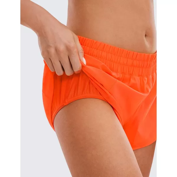 CRZ YOGA Womens Running Shorts Low Waisted 25  Mesh Liner Quick Dry Track Gym Athletic Workout Shorts with Zip PocketNeon Orange