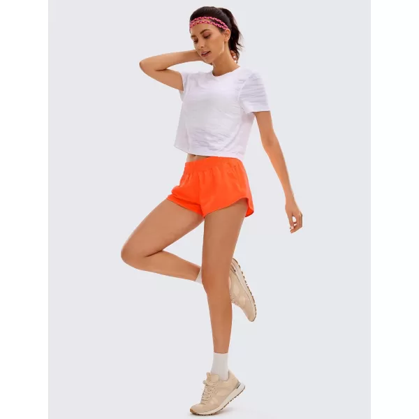 CRZ YOGA Womens Running Shorts Low Waisted 25  Mesh Liner Quick Dry Track Gym Athletic Workout Shorts with Zip PocketNeon Orange