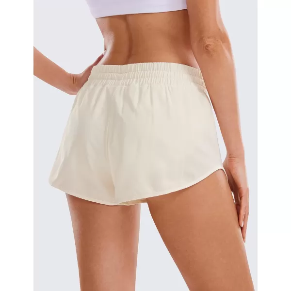 CRZ YOGA Womens Running Shorts Low Waisted 25  Mesh Liner Quick Dry Track Gym Athletic Workout Shorts with Zip PocketWhite Apricot