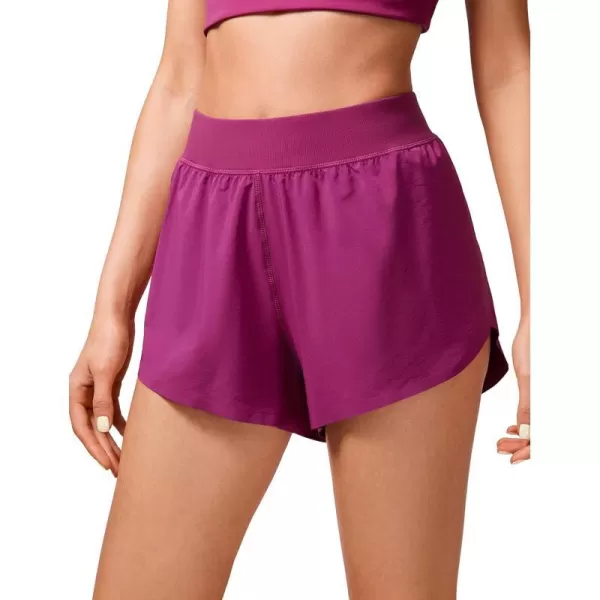 CRZ YOGA Mid Waisted Dolphin Athletic Running Shorts for Women Lightweight High Split Gym Workout Shorts with Liner Quick DryMagenta Purple