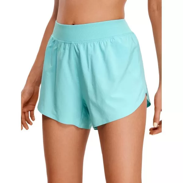 CRZ YOGA Mid Waisted Dolphin Athletic Running Shorts for Women Lightweight High Split Gym Workout Shorts with Liner Quick DryTurquoise